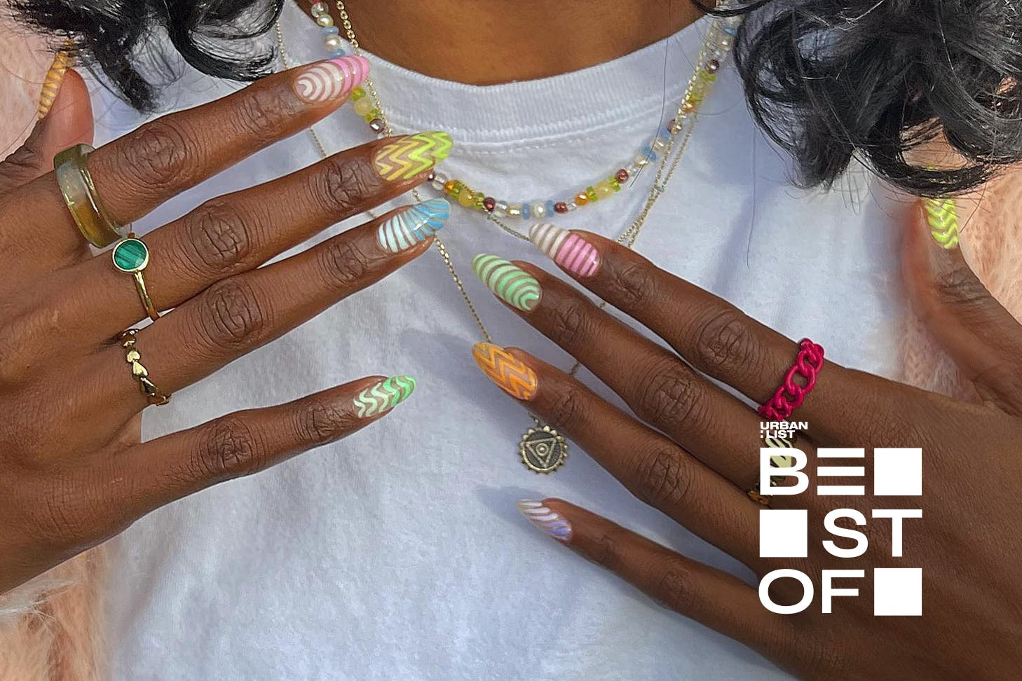 Someone holds up their gorgeous nails by Dune Nails, one of the best nail salons in Auckland.